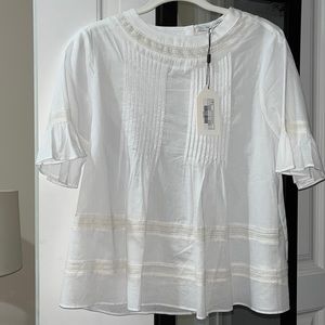 English factory, white short sleeve ruffle blouse, size small. New with tags